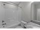 Clean bathroom with a shower-tub combination, toilet, and granite vanity top at 5554 Lake Vista Ct, Rocky Mount, NC 27803