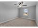 Bedroom with neutral carpeting, ceiling fan and a window bringing in natural light at 5554 Lake Vista Ct, Rocky Mount, NC 27803
