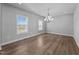 Dining room featuring natural light, a modern chandelier and beautiful flooring at 5554 Lake Vista Ct, Rocky Mount, NC 27803