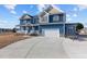 Inviting home boasts a large driveway and garage, offering plenty of space for vehicles at 5554 Lake Vista Ct, Rocky Mount, NC 27803