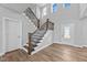 Welcoming foyer with a staircase, hardwood floors, and ample natural light at 5554 Lake Vista Ct, Rocky Mount, NC 27803