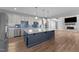Spacious kitchen with a large center island, stainless steel appliances, and a view into the living room at 5554 Lake Vista Ct, Rocky Mount, NC 27803