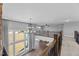 Bright and open floor plan showcasing a living area with large windows and wrought iron railing at 5554 Lake Vista Ct, Rocky Mount, NC 27803