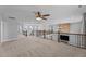 Spacious living room shows the open floor plan, stone fireplace, and plenty of light at 5554 Lake Vista Ct, Rocky Mount, NC 27803