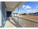 Inviting front porch with white railings, showcasing the home's curb appeal and neighborhood view at 5554 Lake Vista Ct, Rocky Mount, NC 27803