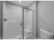 Bathroom featuring a tiled shower with glass door and built-in seat at 5554 Lake Vista Ct, Rocky Mount, NC 27803