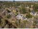 Scenic aerial view of a home surrounded by lush trees, offering privacy and a connection with nature at 126 E Drewry Ln, Raleigh, NC 27609