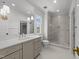 Bright bathroom with glass-enclosed shower, quartz countertops, and chrome fixtures at 126 E Drewry Ln, Raleigh, NC 27609