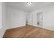 This bedroom features hardwood floors and two access doors at 126 E Drewry Ln, Raleigh, NC 27609