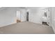 Spacious bedroom featuring carpet floors and three doors leading to different spaces at 126 E Drewry Ln, Raleigh, NC 27609