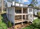 Gorgeous back of house view with a spacious two-level deck perfect for entertaining and outdoor enjoyment at 126 E Drewry Ln, Raleigh, NC 27609