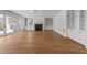 Spacious living room featuring hardwood floors, custom built-ins, and a marble fireplace at 126 E Drewry Ln, Raleigh, NC 27609