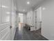 Mudroom with coat rack, bench, and gray tile flooring at 126 E Drewry Ln, Raleigh, NC 27609