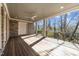 Spacious covered back patio with wood-look decking, and an outdoor ceiling fan at 126 E Drewry Ln, Raleigh, NC 27609