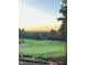Property overlooks a beautiful golf course with sunset views at 143 High Ridge Ln, Pittsboro, NC 27312