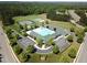 Aerial view of community pool, clubhouse, tennis courts, and playground at 143 High Ridge Ln, Pittsboro, NC 27312