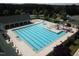 Community pool with lap lanes, a water slide, and plenty of lounge chairs at 143 High Ridge Ln, Pittsboro, NC 27312