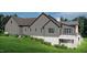 Another side view highlighting the home's architectural details and landscaping at 143 High Ridge Ln, Pittsboro, NC 27312