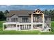 Home's back exterior features a deck, patio, and walkout basement at 143 High Ridge Ln, Pittsboro, NC 27312