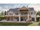 Stunning home exterior with large deck and hot tub at 143 High Ridge Ln, Pittsboro, NC 27312