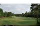 Elevated view of a manicured golf course with surrounding trees and distant homes at 143 High Ridge Ln, Pittsboro, NC 27312