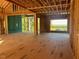 Spacious living area framing with large windows and scenic views at 143 High Ridge Ln, Pittsboro, NC 27312