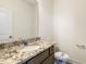 Small bathroom with granite vanity, single sink, and toilet at 182 Ford Meadows Dr, Garner, NC 27529