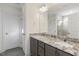 Double vanity bathroom with granite countertops and large mirror at 182 Ford Meadows Dr, Garner, NC 27529