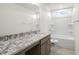 Clean bathroom with granite countertop and a bathtub at 182 Ford Meadows Dr, Garner, NC 27529