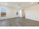 Bright bedroom with wood-look floors and two large windows at 182 Ford Meadows Dr, Garner, NC 27529