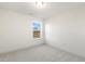 Well-lit bedroom with neutral carpet and large window at 182 Ford Meadows Dr, Garner, NC 27529