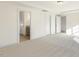 Well-lit bedroom with carpet flooring and en-suite bathroom access at 182 Ford Meadows Dr, Garner, NC 27529