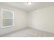 Simple bedroom with a window and carpeted floor at 182 Ford Meadows Dr, Garner, NC 27529