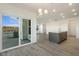 Dining area with sliding glass doors and kitchen island view at 182 Ford Meadows Dr, Garner, NC 27529