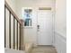Bright entryway with hardwood floors, staircase, and view of the living room at 182 Ford Meadows Dr, Garner, NC 27529