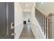 Bright entryway with hardwood floors, staircase, and view of living room at 182 Ford Meadows Dr, Garner, NC 27529
