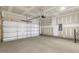 Spacious garage with overhead door and ample storage space at 182 Ford Meadows Dr, Garner, NC 27529