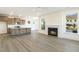 Open concept kitchen with island, granite countertops, and hardwood floors at 182 Ford Meadows Dr, Garner, NC 27529