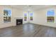 Spacious living room featuring a fireplace and wood-look floors at 182 Ford Meadows Dr, Garner, NC 27529