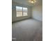 Bedroom with neutral carpet, natural light, and large window with outdoor views at 23 Quail Pt Cir, Clayton, NC 27520