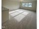 Bright, carpeted bonus room with natural light from multiple windows showcasing neighborhood views at 23 Quail Pt Cir, Clayton, NC 27520