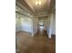 Bright hallway with wood-look floors and detailed trim, seamlessly connecting living spaces at 23 Quail Pt Cir, Clayton, NC 27520