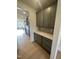 Kitchen with stylish gray cabinets, plenty of counter space, and hardwood floors at 23 Quail Pt Cir, Clayton, NC 27520
