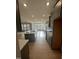 This modern kitchen features stainless appliances and a large center island at 23 Quail Pt Cir, Clayton, NC 27520