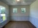 This office features decorative trim, hardwood floors and natural light from windows at 23 Quail Pt Cir, Clayton, NC 27520