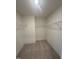 An organized walk-in closet with shelving offers ample storage space and convenience at 23 Quail Pt Cir, Clayton, NC 27520