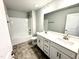 Elegant bathroom with double vanity, large mirror, and modern fixtures at 328 Bishop Lane, Sanford, NC 27330