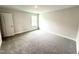 A carpeted bedroom with a window and neutral paint, offers a comfortable space ready for personalization at 328 Bishop Lane, Sanford, NC 27330