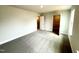 Spacious bedroom featuring neutral color palette, carpeted flooring, and convenient closet access at 328 Bishop Lane, Sanford, NC 27330
