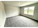 Bedroom with gray carpet and large window for natural light at 328 Bishop Lane, Sanford, NC 27330